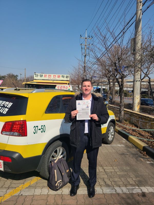 Foreign student at the SDA Anyang campus after completing the Korean licence course