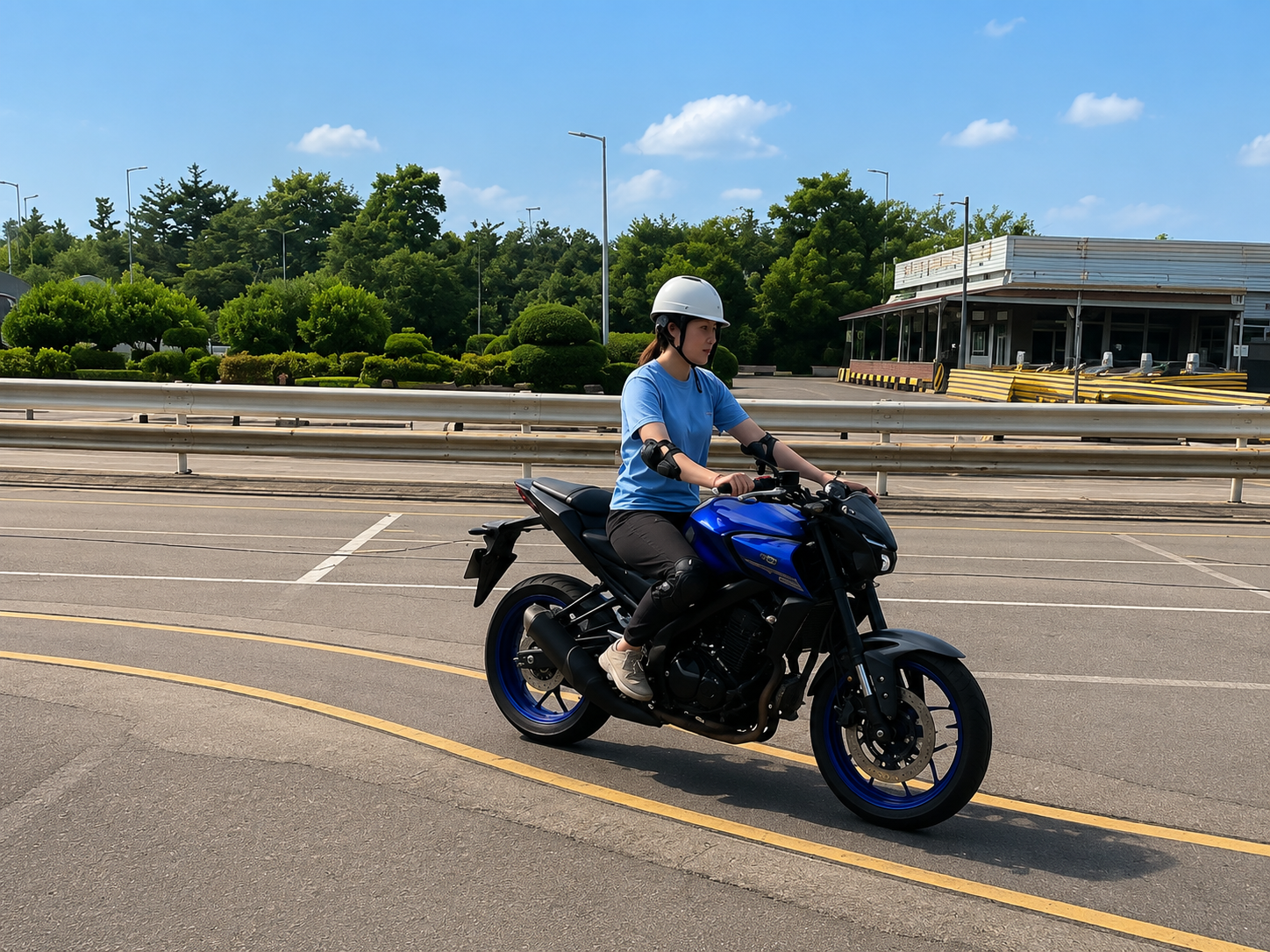 Student practising motorcycle slalom in full safety gear at the SDA circuit
